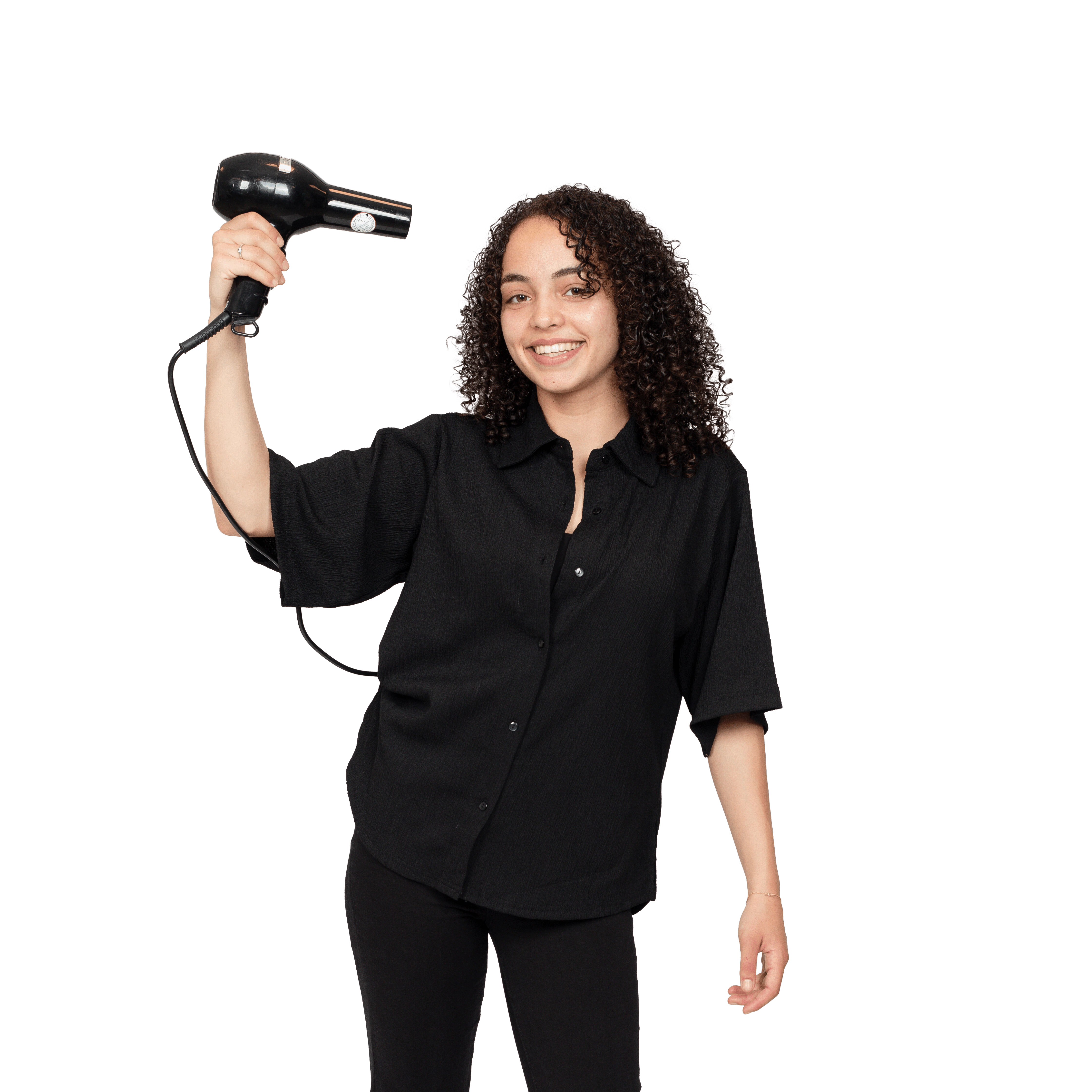 Meisje met een fรถhn in haar hand kijkt naar de camera